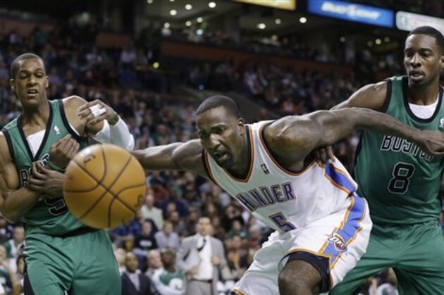 Oklahoma City Thunder center Kendrick Perkins (5) and Boston Celtics guard Rajon Rondo, left, and forward Jeff Green (8) watch a ball head out of bounds during the second half of an NBA basketball game in Boston, Friday, Nov. 23, 2012. The Celtics won 108-100. (AP Photo/Elise Amendola)