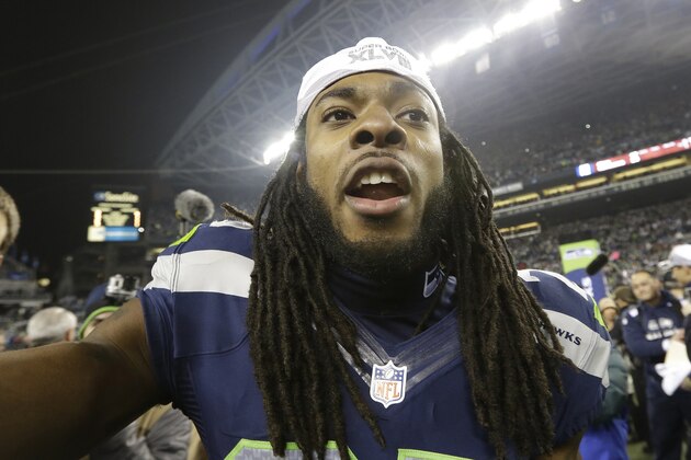 Seattle Seahawks' Richard Sherman celebrates after the NFL football NFC Championship game against the San Francisco 49ers, Sunday, Jan. 19, 2014, in Seattle. The Seahawks won 23-17 to advance to Super Bowl XLVIII. (AP Photo/Elaine Thompson)