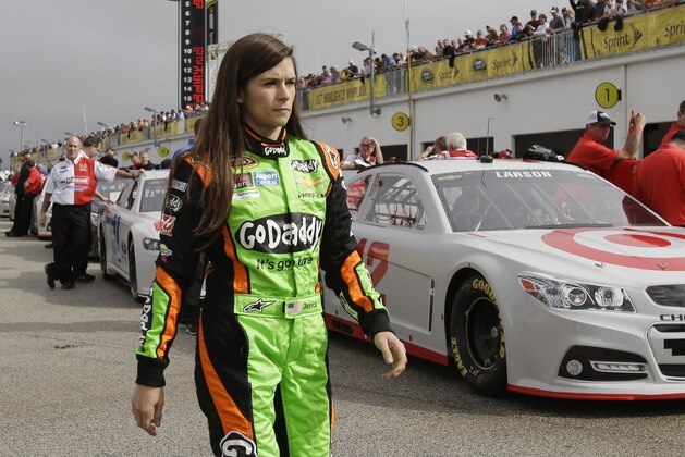 NASCAR driver Danica Patrick walks to her car on pit road during Sprint Cup auto racing testing at Daytona International Speedway in Daytona Beach, Fla., Friday, Jan. 10, 2014.(AP Photo/John Raoux)