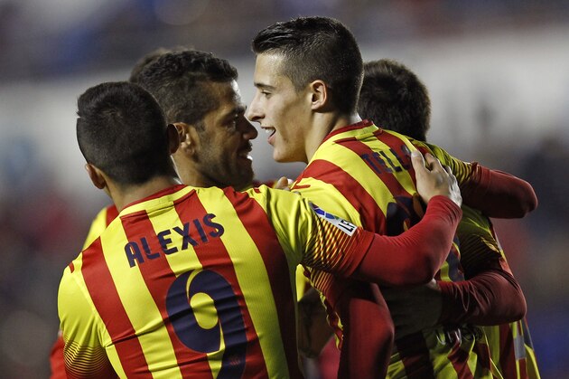 Barcelona's Cristian Tello, right,  celebrates after scoring against Levante during their la Copa del Rey soccer match at the Ciutat de Valencia stadium in Valencia, Spain, Wednesday Jan. 22, 2014. (AP Photo/Alberto Saiz)