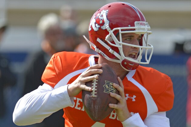 South Squad quarterback Derek Carr of Fresno State (4) looks for a receiver during Senior Bowl practice at Fairhope Municipal Stadium, Monday, Jan. 20, 2014 in Fairhope, Ala. (AP Photo/G.M. Andrews)