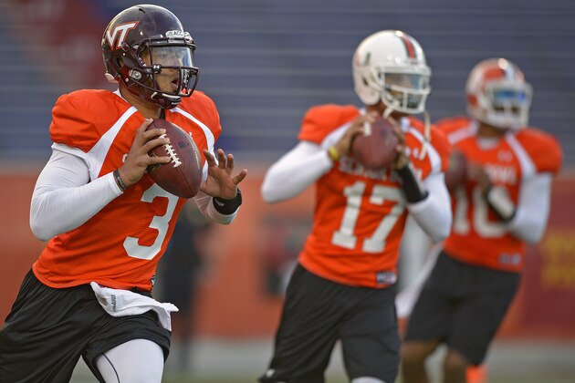 North Squad quarterback Logan Thomas of Virginia Tech (3) drops back with fellow quarterbacks Stephen Morris of Miami (17), middle, and Tajh Boyd of Clemson (10), right, during Senior Bowl practice at Ladd-Peebles Stadium, Monday, Jan. 20, 2014, in Mobile, Ala.  (AP Photo/G.M. Andrews)