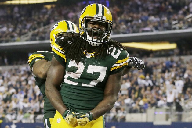 Green Bay Packers running back Eddie Lacy (27) celebrates his touchdown against the Dallas Cowboys during the second half of an NFL football game, Sunday, Dec. 15, 2013, in Arlington, Texas. (AP Photo/Tony Gutierrez)