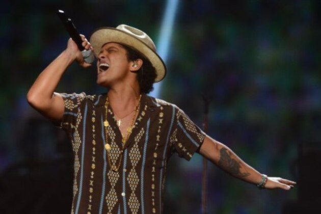 FILE - In this Sept. 21, 2013 file photo, Bruno Mars performs at IHeartRadio Music Festival in Las Vegas. The 28-year-old, Mars latest album, “Unorthodox Jukebox,”  is nominated for four honors at Sunday’s Grammy Awards in Los Angeles. (Photo by Al Powers/Powers Imagery/Invision /AP, File)