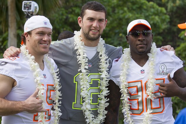 Indianapolis Colts long snapper Matt Overton, left, of Team Rice, Indianapolis Colts quarterback Andrew Luck (12) of Team Sanders and Indianapolis Colts outside linebacker Robert Mathis (98) of Team Rice pose for a picture during Pro Bowl picture day, Friday, Jan. 24, 2014, in Kapolei, Hawaii. (AP Photo/Eugene Tanner)