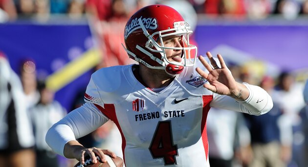 Fresno State quarterback Derek Carr looks to throw the ball against Southern California during the second quarter of the Royal Purple Bowl NCAA college football game, Saturday, Dec. 21, 2013, in Las Vegas. (AP Photo/David Cleveland)