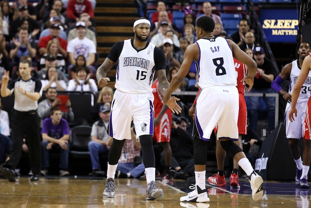 Dec 15, 2013; Sacramento, CA, USA; Sacramento Kings center DeMarcus Cousins (15) celebrates with forward Rudy Gay (8) after a play against the Houston Rockets during the first quarter at Sleep Train Arena. Mandatory Credit: Kelley L Cox-USA TODAY Sports