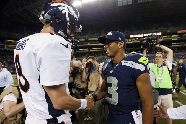 ADVANCE FOR WEEKEND EDITIONS, JAN. 25-26 - FILE - In this Aug. 17, 2013, file photo, Seattle Seahawks quarterback Russell Wilson (3) shakes hands with Denver Broncos quarterback Peyton Manning, left, after the Seahawks beat the Broncos 40-10 in preseason NFL football game  in Seattle. The two teams are slated to meet in Super Bowl XLVIII on Sunday, Feb. 2, 2014, in East Rutherford, N.J. (AP Photo/John Froschauer, File)