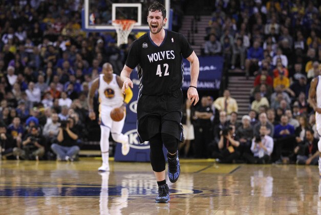 Jan 24, 2014; Oakland, CA, USA; Minnesota Timberwolves forward Kevin Love (42) reacts after suffering an injury against the Golden State Warriors in the third quarter at Oracle Arena. The Timberwolves defeated the Warriors 121-120. Mandatory Credit: Cary Edmondson-USA TODAY Sports