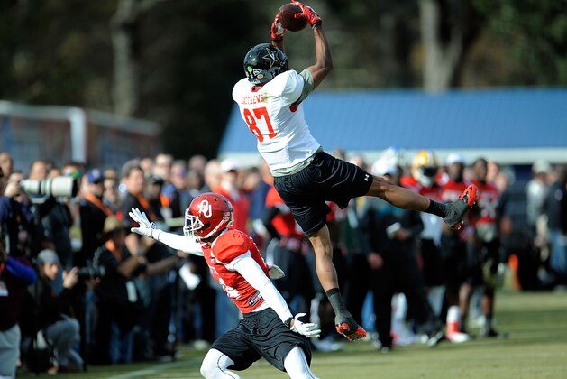 FAIRHOPE, AL - JANUARY 20:  Jordan Matthews #87 of the South team catches a pass over Aaron Colvin #14 during a Senior Bowl practice session at Fairhope Stadium on January 20, 2014 in Fairhope, Alabama.  (Photo by Stacy Revere/Getty Images)
