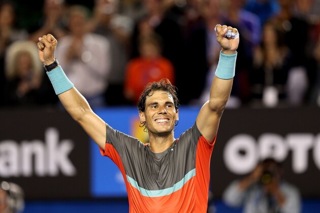 MELBOURNE, AUSTRALIA - JANUARY 24:  Rafael Nadal of Spain celebrates winning his semifinal match against Roger Federer of Switzerland during day 12 of the 2014 Australian Open at Melbourne Park on January 24, 2014 in Melbourne, Australia.  (Photo by Clive Brunskill/Getty Images)