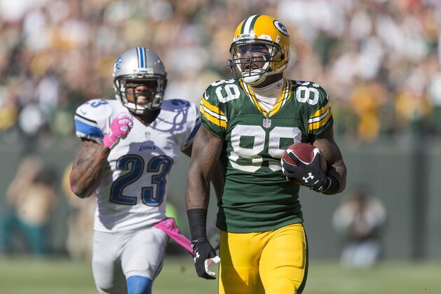 GREEN BAY, WI - OCTOBER 6:  James Jones #89 of the Green Bay Packers runs during a 83 yard touchdown catch against the Chris Houston #23 of the Detroit Lions at Lambeau Field on October 6, 2013 in Green Bay, Wisconsin.  The Packers defeated the Lions 22-9.  (Photo Tom Lynn /Getty Images)