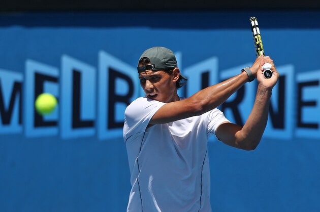 Rafael Nadal of Spain hits a shot during a training session, one day before his men's singles final against Stanislas Wawrinka of Switzerland at the Australian Open tennis championship in Melbourne, Australia, Saturday, Jan. 25, 2014. (AP Photo/Shuji Kajiyama)