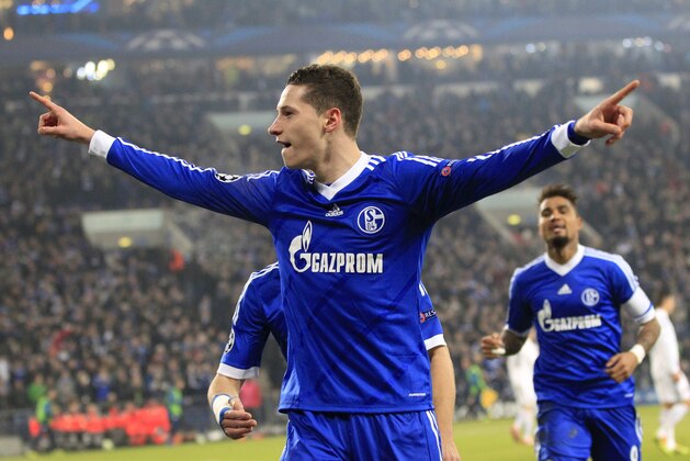 Schalke's Julian Draxler celebrates after scoring his side's opening goal during the Champions League group E soccer match between FC Schalke 04 and FC Basel in Gelsenkirchen, Germany, Wednesday, Dec.11,2013. (AP Photo/Frank Augstein)