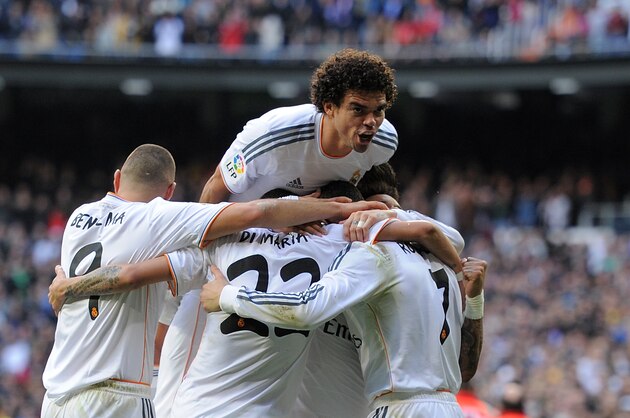 MADRID, SPAIN - JANUARY 25:  Pepe of Real Madrid CF celebrates with Cristiano Ronaldo (R) after Ronaldo scored Real's opening goal during the La Liga match between Real Madrid CF and Granada CF at Santiago Bernabeu stadium on January 25, 2014 in Madrid, Spain.  (Photo by Denis Doyle/Getty Images)