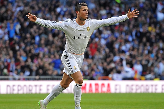 MADRID, SPAIN - JANUARY 25:  Cristiano Ronaldo of Real Madrid CF celebrates after scoring the opening goal during the La Liga match between Real Madrid CF and Granada CF at Santiago Bernabeu stadium on January 25, 2014 in Madrid, Spain.  (Photo by Denis Doyle/Getty Images)