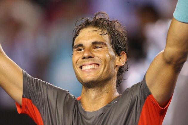 MELBOURNE, AUSTRALIA - JANUARY 24:  Rafael Nadal of Spain celebrates winning his semifinal match against Roger Federer of Switzerland during day 12 of the 2014 Australian Open at Melbourne Park on January 24, 2014 in Melbourne, Australia.  (Photo by Quinn Rooney/Getty Images)