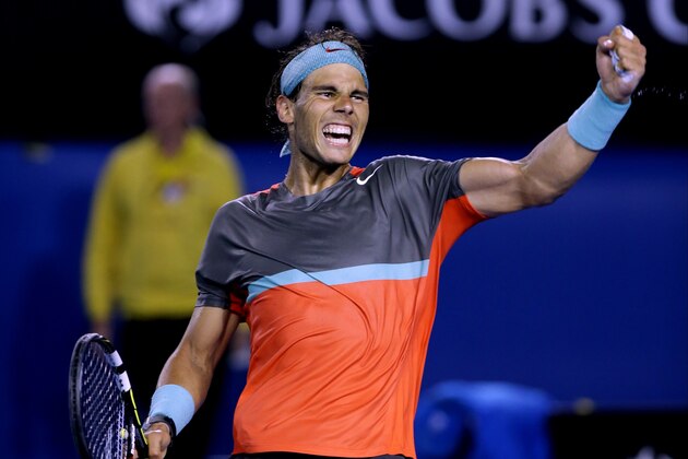 Rafael Nadal of Spain celebrates after defeating Roger Federer of Switzerland during their semifinal at the Australian Open tennis championship in Melbourne, Australia, Friday, Jan. 24, 2014. (AP Photo/Aaron Favila)