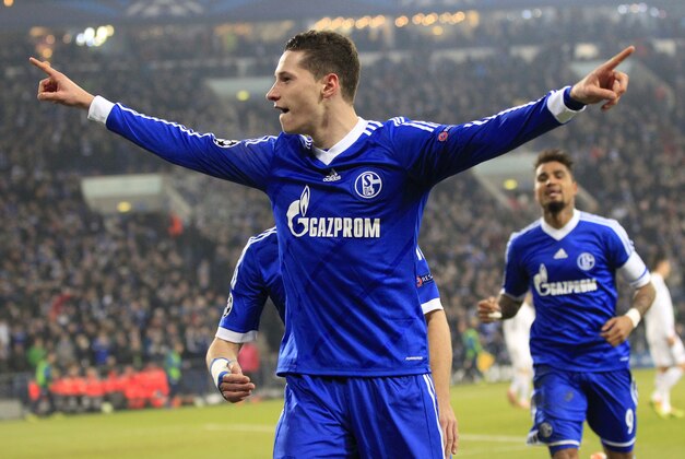 Schalke's Julian Draxler celebrates after scoring his side's opening goal during the Champions League group E soccer match between FC Schalke 04 and FC Basel in Gelsenkirchen, Germany, Wednesday, Dec.11,2013. (AP Photo/Frank Augstein)