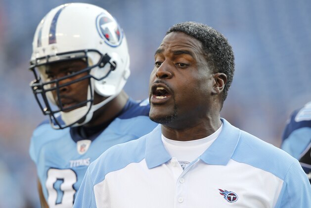Tennessee Titans defensive line coach Tracy Rocker talks to players before of an NFL football preseason game between the Minnesota Vikings and the Tennessee Titans on Saturday, Aug. 13, 2011, in Nashville, Tenn. (AP Photo/Wade Payne)