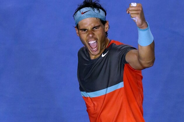 Rafael Nadal of Spain celebrates after defeating Roger Federer of Switzerland during their semifinal at the Australian Open tennis championship in Melbourne, Australia, Friday, Jan. 24, 2014. (AP Photo/Eugene Hoshiko)