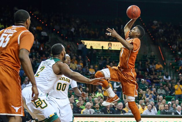 Jan 25, 2014; Waco, TX, USA; Texas Longhorns guard Isaiah Taylor (1) shoots over Baylor Bears forward Rico Gathers (2) during the first half at The Ferrell Center. Mandatory Credit: Kevin Jairaj-USA TODAY Sports