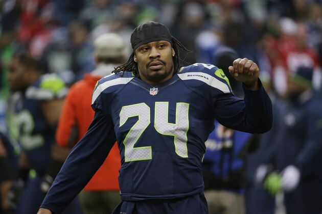 Seattle Seahawks' Marshawn Lynch (24) warms up before the NFL football NFC Championship game against the San Francisco 49ers Sunday, Jan. 19, 2014, in Seattle. (AP Photo/Ted S. Warren)