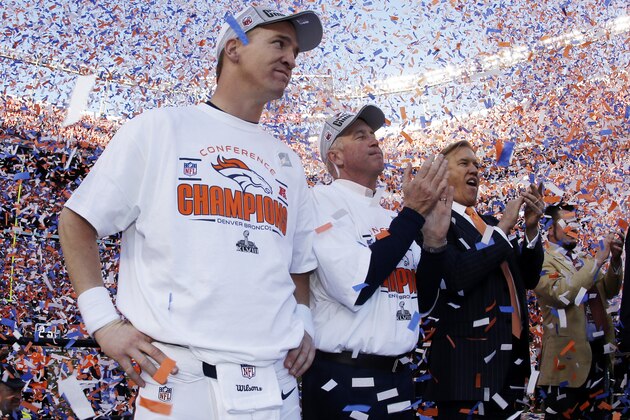 ADVANCE FOR WEEKEND EDITIONS, JAN. 25-26 - In this Jan. 19, 2014, file photo, Denver Broncos quarterback Peyton Manning, stands with  head coach  John Fox and Broncos vice president John Elway during the trophy ceremony after the AFC Championship NFL playoff football game in Denver. When he faces the Seattle Seahawks next Sunday, Manning can become the first starting quarterback to win the Super Bowl with two franchises. (AP Photo/Charlie Riedel, File)