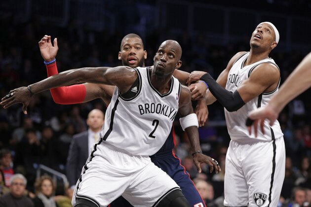 Brooklyn Nets forward Kevin Garnett (2) and Nets forward Paul Pierce (34) defend Detroit Pistons forward Greg Monroe (10) in the second half of an NBA basketball game, Sunday, Nov. 24, 2013, in New York. The Pistons won 109-97. (AP Photo/Kathy Willens) Brooklyn Nets forward Kevin Garnett (2) and Nets forward Paul Pierce (34) defend Detroit Pistons forward Greg Monroe (10) in the second half of an NBA basketball game, Sunday, Nov. 24, 2013, in New York. The Pistons won 109-97. (AP Photo/Kathy Willens)