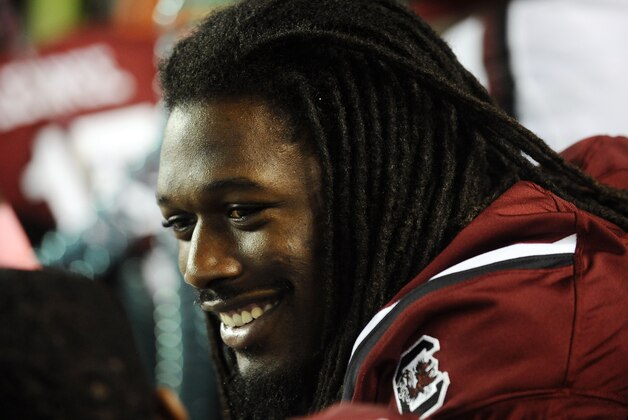 South Carolina defensive end Jadeveon Clowney smiles as he sits on the bench during the first half of an NCAA college football game against Kentucky, Saturday, Oct. 5, 2013, in Columbia, S.C. (AP Photo/Rainier Ehrhardt)