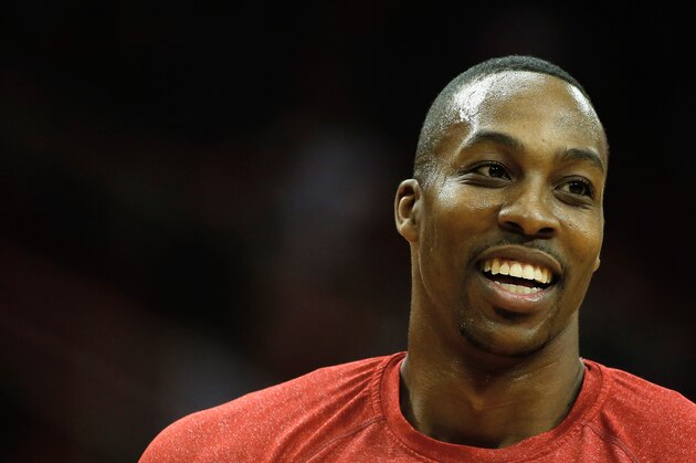 HOUSTON, TX - JANUARY 24:  Dwight Howard #12 of the Houston Rockets waits on the court before the game against the Memphis Grizzlies at the Toyota Center on January 24, 2014 in Houston, Texas. NOTE TO USER: User expressly acknowledges and agrees that, by downloading and or using this photograph, User is consenting to the terms and conditions of the Getty Images License Agreement.  (Photo by Scott Halleran/Getty Images)