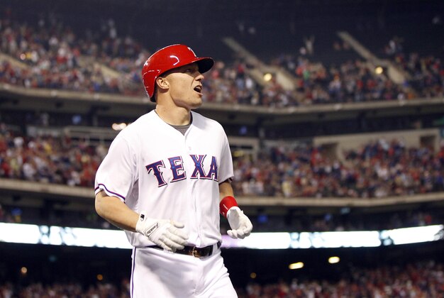 Apr 30, 2013; Arlington, TX, USA; Texas Rangers left fielder Jeff Baker (15) celebrates hitting a home run in the fourth inning against the Chicago White Sox at Rangers Ballpark in Arlington. Mandatory Credit: Tim Heitman-USA TODAY Sports