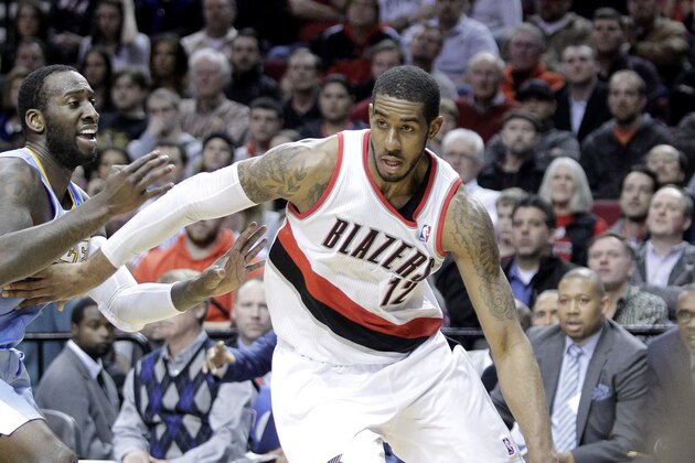 Portland Trail Blazers forward LaMarcus Aldridge, right, drives to the hoop past Denver Nuggets center JJ Hickson during the second half of an NBA basketball game in Portland, Ore., Thursday, Jan. 23, 2014.  Aldridge scored 44 points, pulled in 13 rebounds and sank 14 free throws as they beat the Nuggets 110-105.  (AP Photo/Don Ryan)