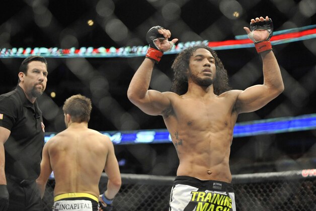 Jan 25, 2014; Chicago, IL, USA; Benson Henderson (red gloves) reacts after defeating Josh Thomson (blue gloves) during UFC on FOX 10 at the United Center. Mandatory Credit: David Banks-USA TODAY Sports Jan 25, 2014; Chicago, IL, USA; Benson Henderson (red gloves) reacts after defeating Josh Thomson (blue gloves) during UFC on FOX 10 at the United Center. Mandatory Credit: David Banks-USA TODAY Sports