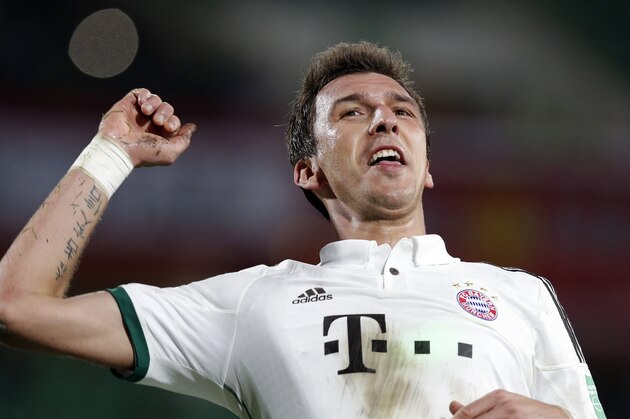 Bayern's Mario Mandzukic celebrates after scoring a goal during the semifinal soccer match between Guangzhou Evergrande and Bayern Munich at the Club World Cup soccer tournament in Agadir, Morocco, Tuesday, Dec. 17, 2013. (AP Photo/Christophe Ena)