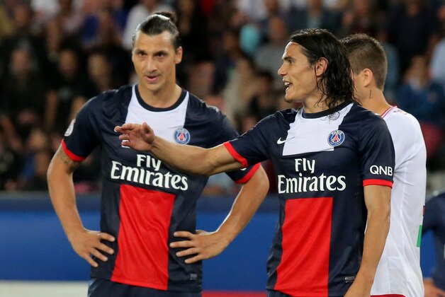 Paris Saint Germain's Uruguayan Edinson Cavani, right, reacts after missing a chance to score, while his teammeate Swedish Zlatan Ibrahimovic stands next to him during a French League One soccer match Paris Saint-Germain against AC Ajaccio Sunday, Aug. 18, 2013, in Paris. The match ended with a 1-1 draw. (AP Photo/Michel Euler)