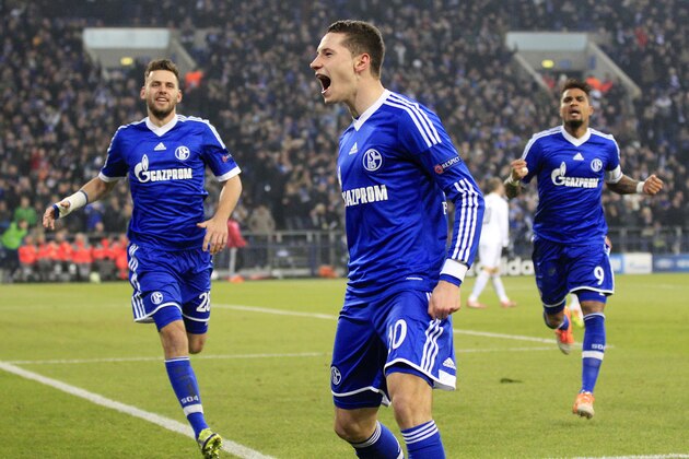 Schalke's Julian Draxler celebrates after scoring his side's opening goal during the Champions League group E soccer match between FC Schalke 04 and FC Basel in Gelsenkirchen, Germany, Wednesday, Dec.11,2013. (AP Photo/Frank Augstein)