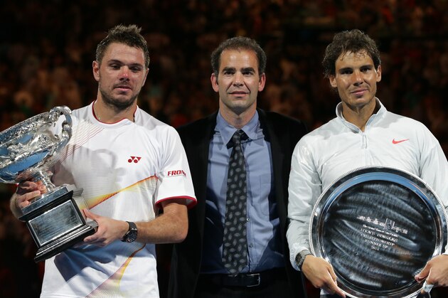 Stanislas Wawrinka of Switzerland, left,  holds the trophy with runner-up Rafael Nadal of Spain, right,  and former world No.1 Pete Sampras, after his win in their  men's singles final at the Australian Open tennis championship in Melbourne, Australia, Sunday, Jan. 26, 2014.(AP Photo/Aaron Favila)
