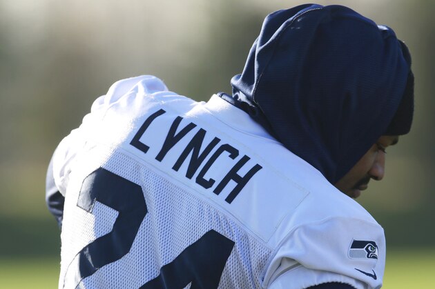Seattle Seahawks running back Marshawn Lynch kneels on the field before NFL football practice, Thursday, Jan. 23, 2014, in Renton, Wash. The Seahawks will play the Denver Broncos Feb. 2, 2014 in the Super Bowl. (AP Photo/Ted S. Warren)