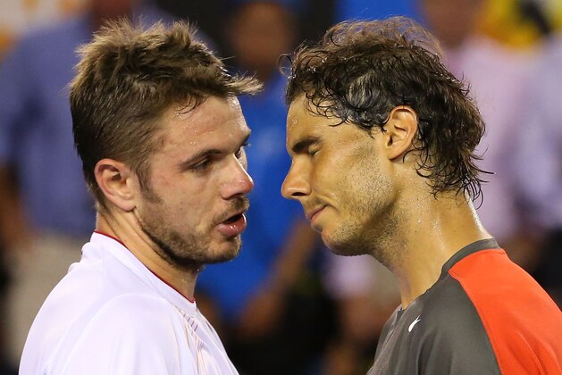 MELBOURNE, AUSTRALIA - JANUARY 26:  Stanislas Wawrinka of Switzerland and Rafael Nadal of Spain hug at the net after Wawrinka won their men's final match during day 14 of the 2014 Australian Open at Melbourne Park on January 26, 2014 in Melbourne, Australia.  (Photo by Scott Barbour/Getty Images)