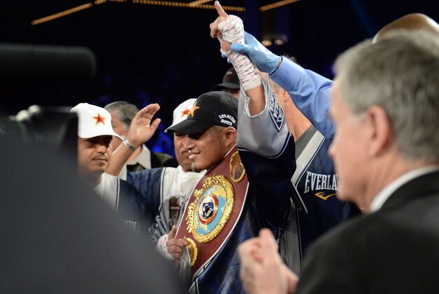 Jan 25, 2014; New York, NY, USA; Mikey Garcia celebrates his win over Juan Carlos Burgos (not pictured) after their WBO junior lightweight title bout at The Theater at Madison Square Garden. Garcia won via unanimous decision. Mandatory Credit: Joe Camporeale-USA TODAY Sports Jan 25, 2014; New York, NY, USA; Mikey Garcia celebrates his win over Juan Carlos Burgos (not pictured) after their WBO junior lightweight title bout at The Theater at Madison Square Garden. Garcia won via unanimous decision. Mandatory Credit: Joe Camporeale-USA TODAY Sports