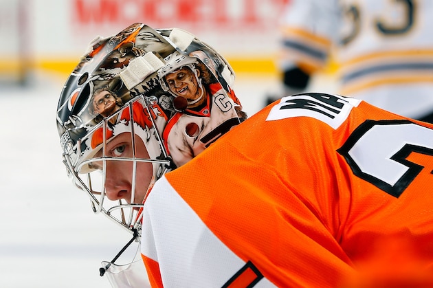 PHILADELPHIA, PA - JANUARY 25: Steve Mason #35 of the Philadelphia Flyers showcases his new helmet during warmups prior to his game against the Boston Bruins at the Wells Fargo Center on January 25, 2014  in Philadelphia, Pennsylvania.  (Photo by Jim McIsaac/NHLI via Getty Images)