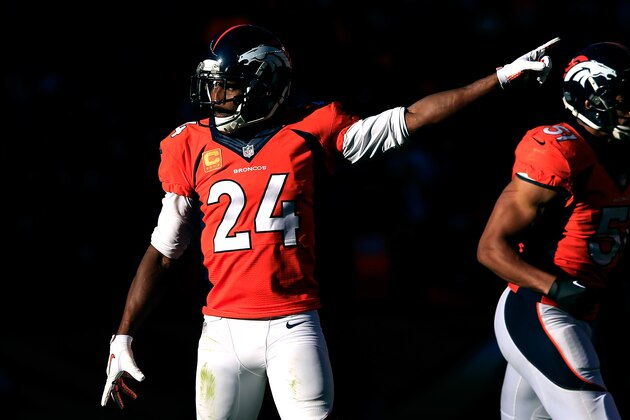 DENVER, CO - JANUARY 19:  Champ Bailey #24 of the Denver Broncos reacts after a play against the New England Patriots during the AFC Championship game at Sports Authority Field at Mile High on January 19, 2014 in Denver, Colorado.  (Photo by Jamie Squire/Getty Images)