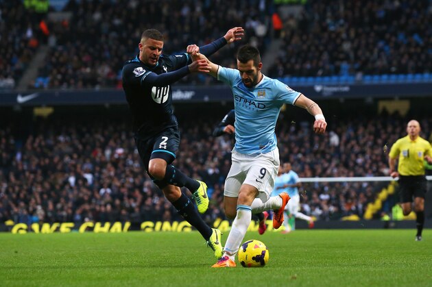 MANCHESTER, ENGLAND - NOVEMBER 24:  Alvaro Negredo of Manchester City holds off a challenge by Kyle Walker of Tottenham Hotspur during the Barclays Premier League match between Manchester City and Tottenham Hotspur at Etihad Stadium on November 24, 2013 in Manchester, England.  (Photo by Alex Livesey/Getty Images)