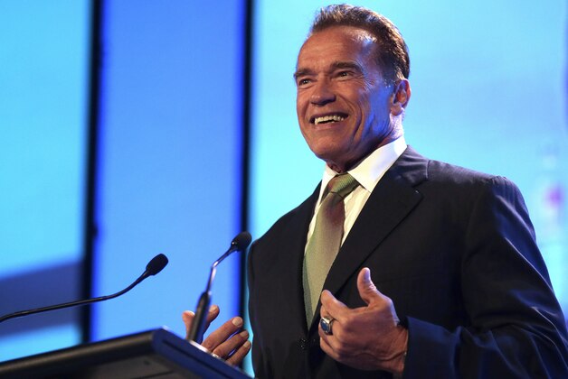 Former Governor of California Arnold Schwarzenegger gestures while he delivers a speech during a Financial Education Summit in Sydney, Australia, Thursday, June 13, 2013. Schwarzenegger was a keynote speaker during the summit that toured Perth, Sydney and Melbourne, speaking about his success in body building, real estate, the film industry and politics. (AP Photo/Rob Griffith)