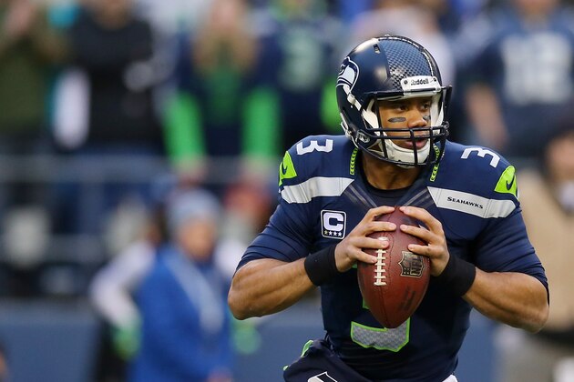 SEATTLE, WA - JANUARY 19:  Quarterback Russell Wilson #3 of the Seattle Seahawks drops back against the San Francisco 49ers during the 2014 NFC Championship at CenturyLink Field on January 19, 2014 in Seattle, Washington.  (Photo by Ronald Martinez/Getty Images)