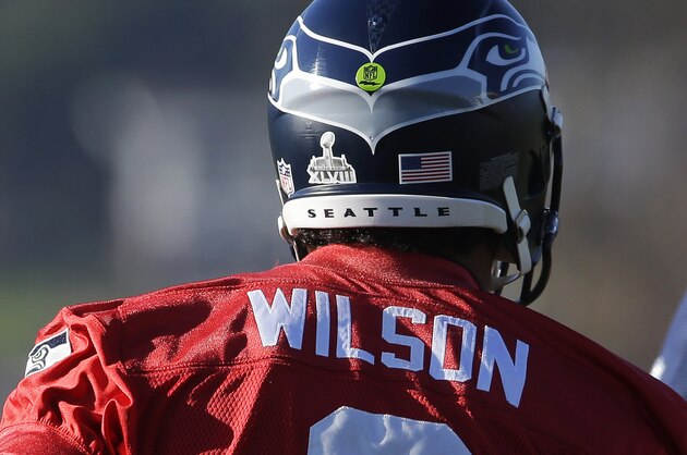 Seattle Seahawks quarterback Russell Wilson's helmet bears a logo for Super Bowl XLVIII before NFL football practice, Thursday, Jan. 23, 2014, in Renton, Wash. The Seahawks play the Denver Broncos on Feb. in the Super Bowl. (AP Photo/Ted S. Warren)