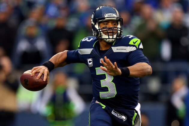 SEATTLE, WA - JANUARY 19:  Quarterback Russell Wilson #3 of the Seattle Seahawks looks to pass in the first quarter against the San Francisco 49ers during the 2014 NFC Championship at CenturyLink Field on January 19, 2014 in Seattle, Washington.  (Photo by Ronald Martinez/Getty Images)