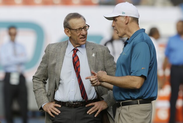 Miami Dolphins owner Stephen Ross, left, speaks with head coach Joe Philbin before an NFL football game against the San Diego Chargers, Sunday, Nov. 17, 2013, in Miami Gardens, Fla. (AP Photo/Wilfredo Lee) Miami Dolphins owner Stephen Ross, left, speaks with head coach Joe Philbin before an NFL football game against the San Diego Chargers, Sunday, Nov. 17, 2013, in Miami Gardens, Fla. (AP Photo/Wilfredo Lee)