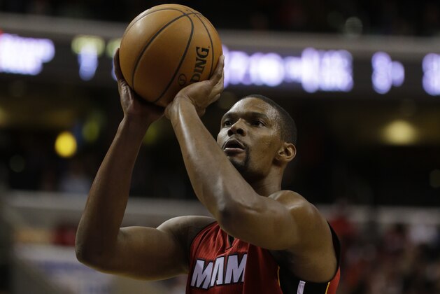 Miami Heat's Chris Bosh in action during an NBA basketball game against the Philadelphia 76ers, Friday, Jan. 17, 2014, in Philadelphia. (AP Photo/Matt Slocum)